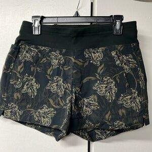Athleta brand Trekkie North green printed shorts.